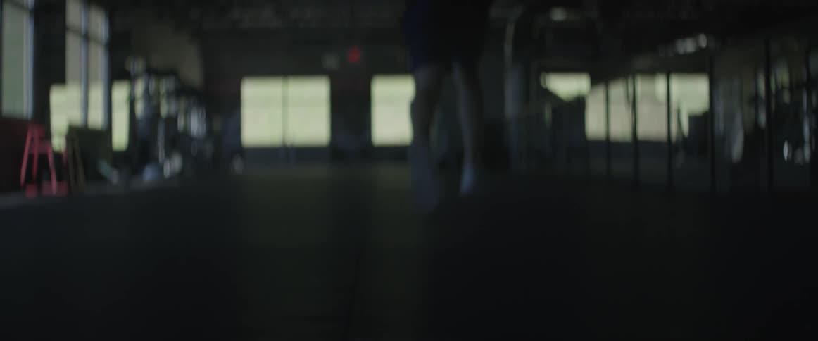 A man does sprints in a gym