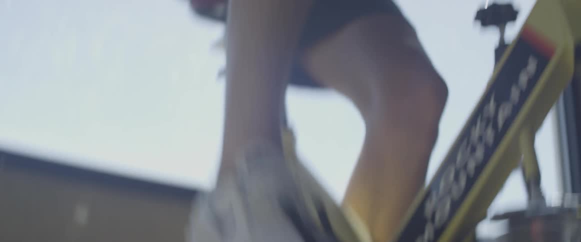 Man peddling on a cycle at a gym