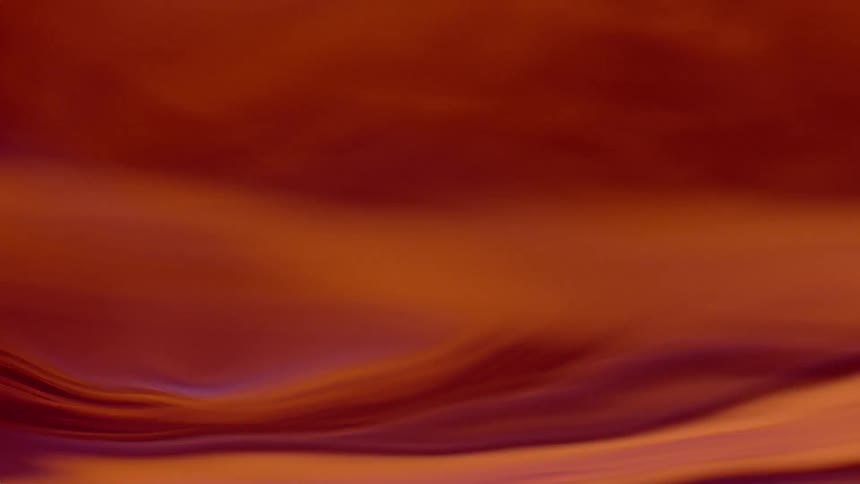 Colors and light blend as liquid drifts in abstract