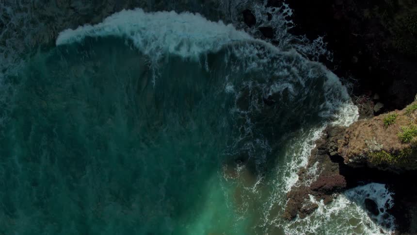 Waves rushing up on rocky beach