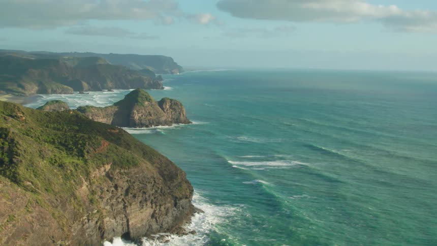 Ocean waves splash and break on the coastal cliffs