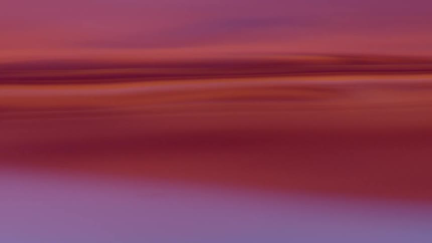 Blue and red waves flow and merge