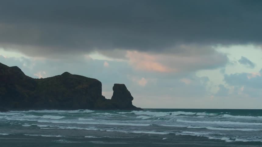 Waves roll toward the shore on a stormy day