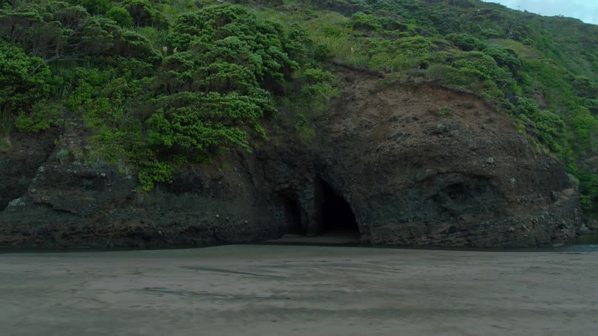 Water flows alongside the rocky shore