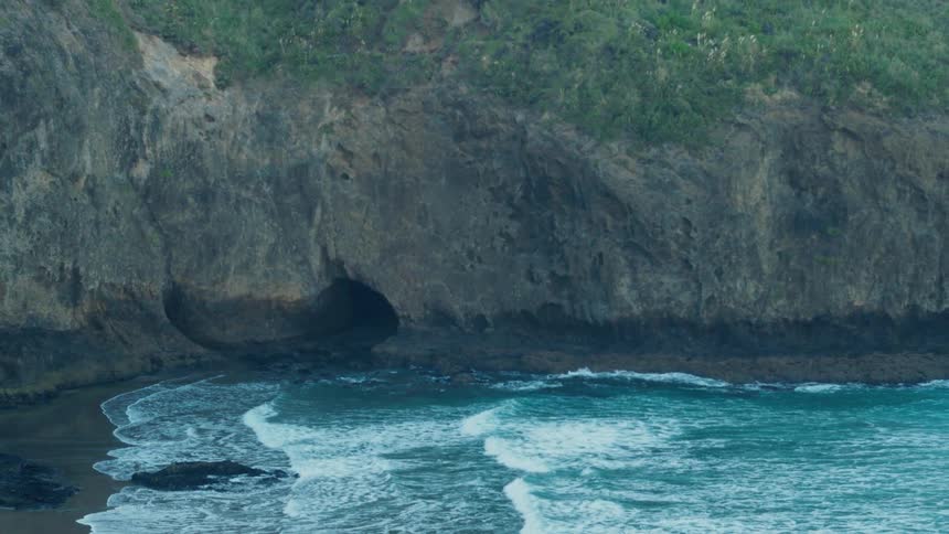 Waves crash onto the rocky shore