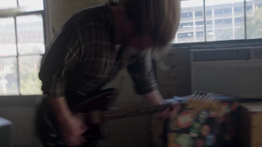 A guitarist rocks out while playing