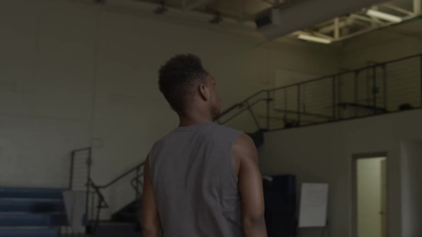 A man practices basketball shots
