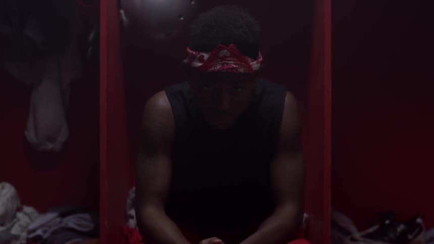 An athlete sits in the locker room