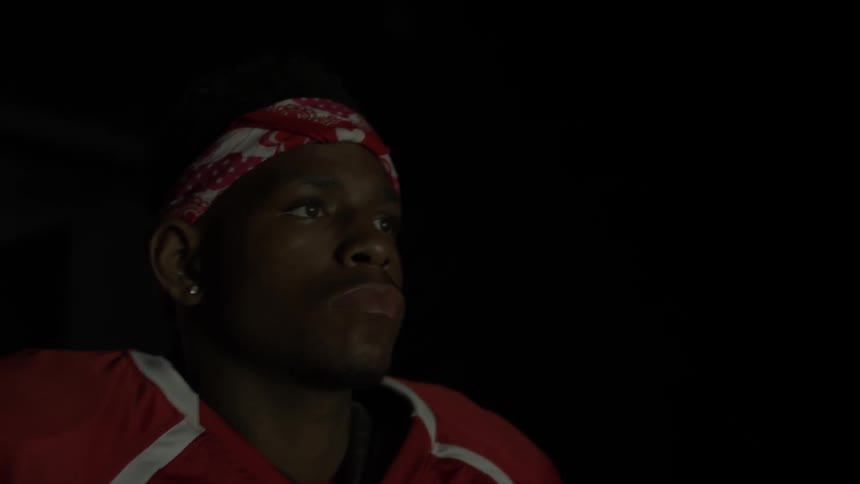 A football walks out of a tunnel