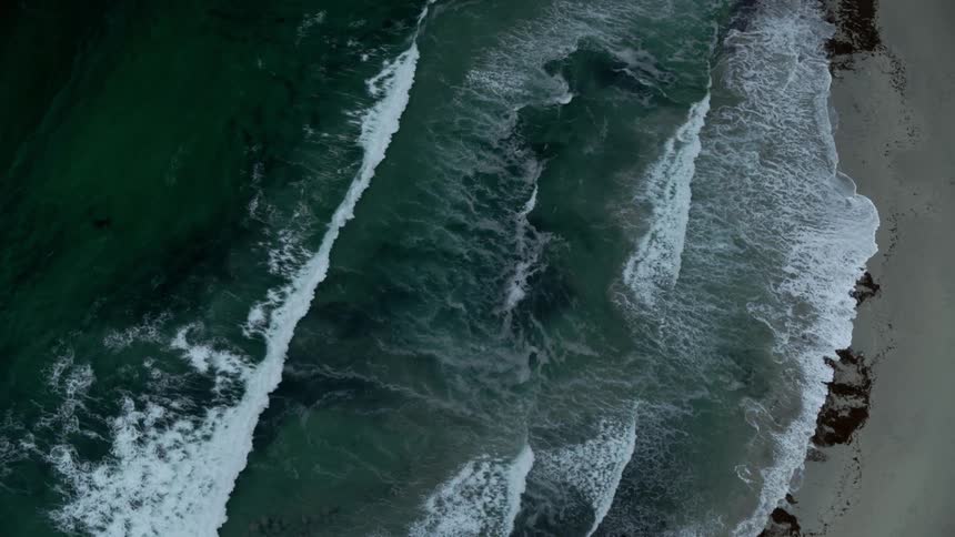 Waves roll onto a beach