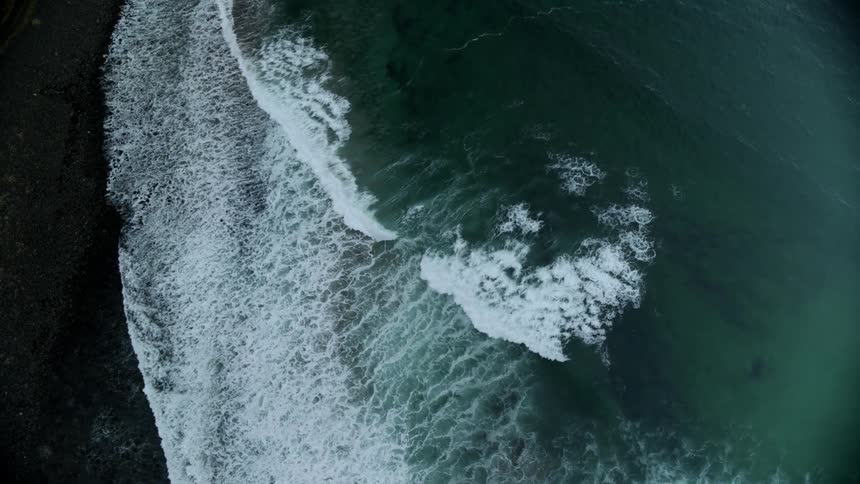 Waves roll toward the shore during the day