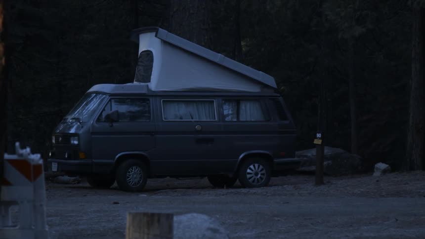 Van is parked with a pop up tent set up