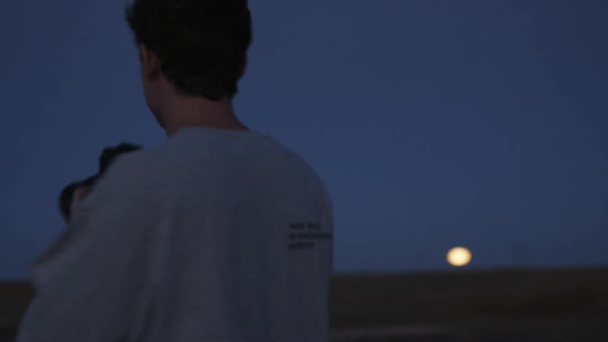 Man takes pictures with a camera while outdoors