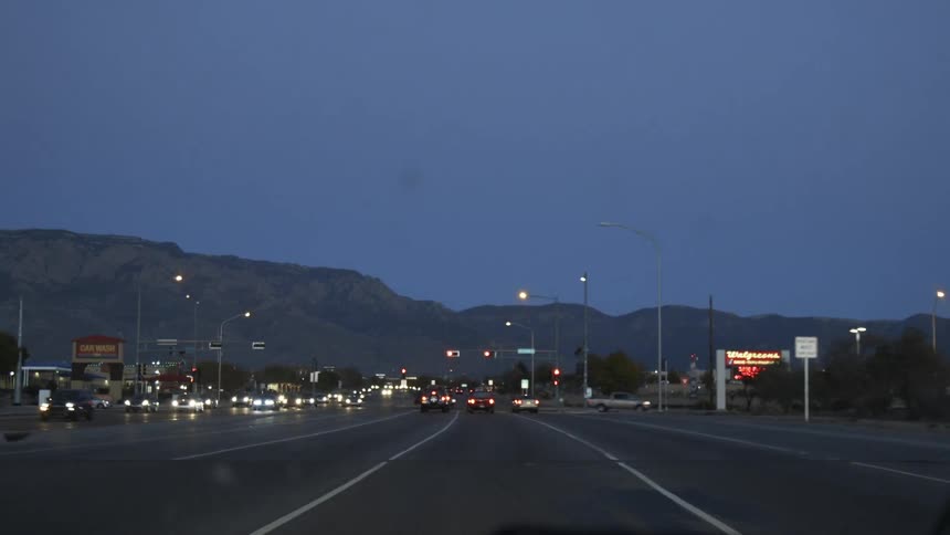 Vehicles travel along a city road