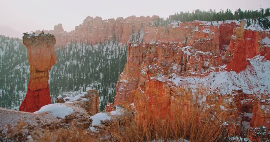 Snow sparsely covers the clay mountains