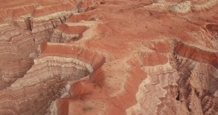 A desert canyon exhibits geological forms and layers