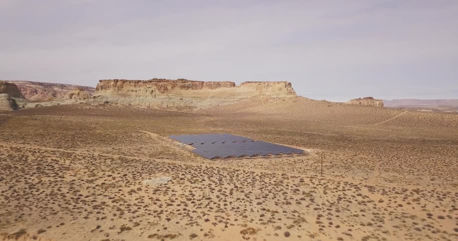 Solar panels in a desert solar farm soak up the sun