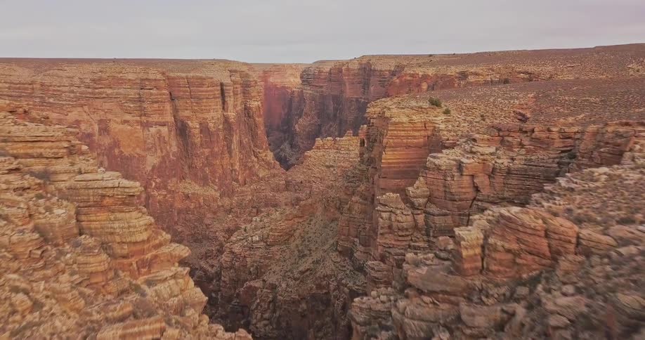 A gorge runs through desert canyon
