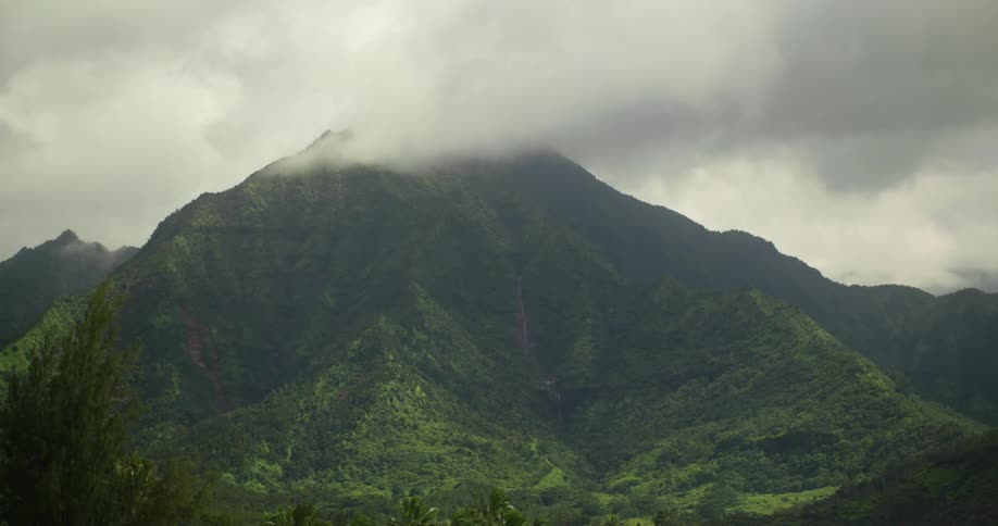 Storm clouds move across the peak of an island mountain