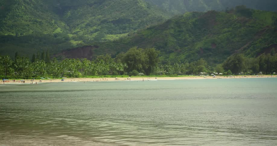 The waves lap a beach on an island shore