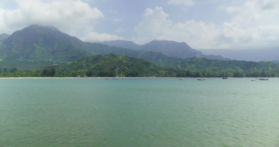 Boats float near the ocean coast