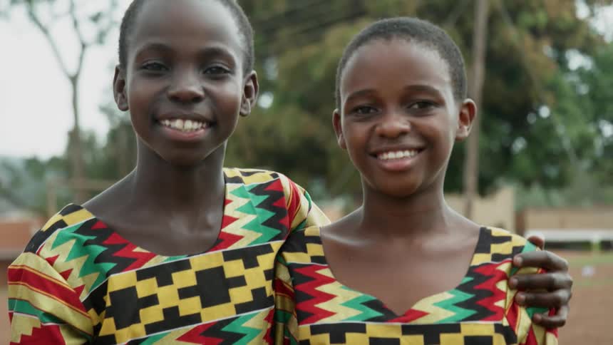 Two african children smiling outdoors