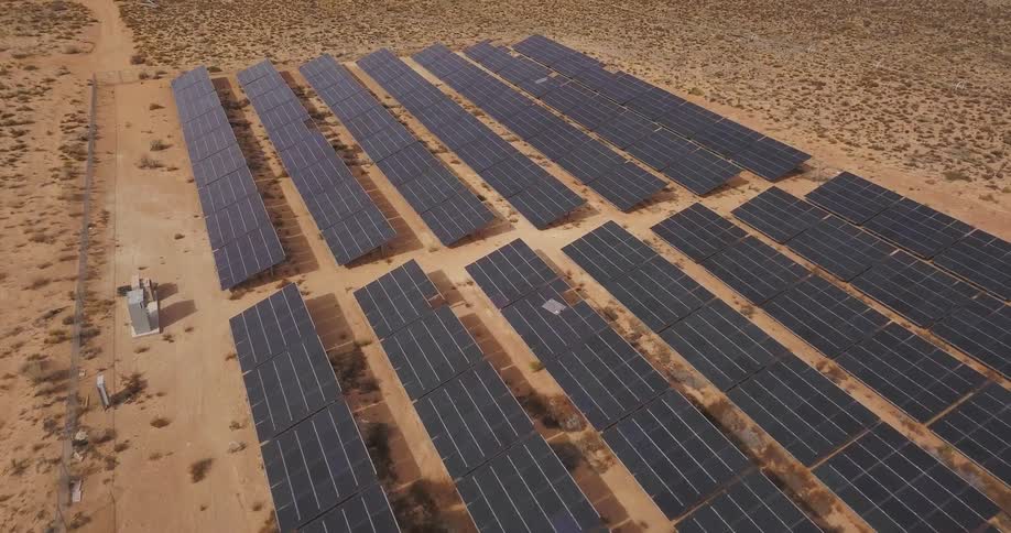 Solar panels in a desert solar farm soak up the sun
