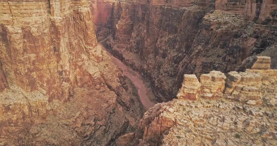 View of a dried up river bed at the bottom of a canyon