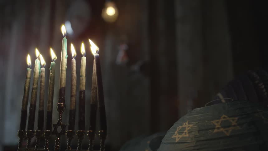 Candles burn in the dark