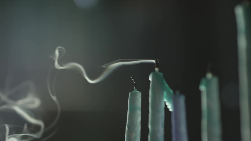 Smoke blowing off of candles