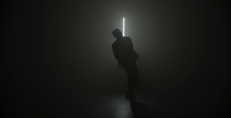 A man's silhouette dancing in the darkness