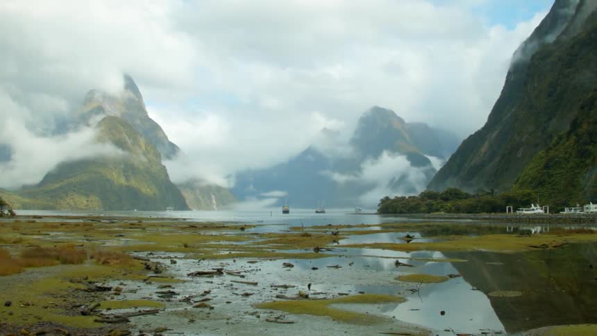 Fog looms around mountains