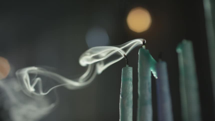 Smoke blowing off of candles