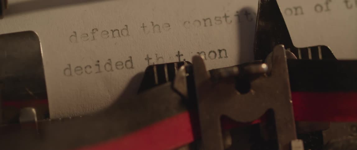A typewriter is making a document