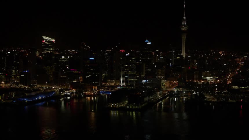 City buildings illuminate the night sky