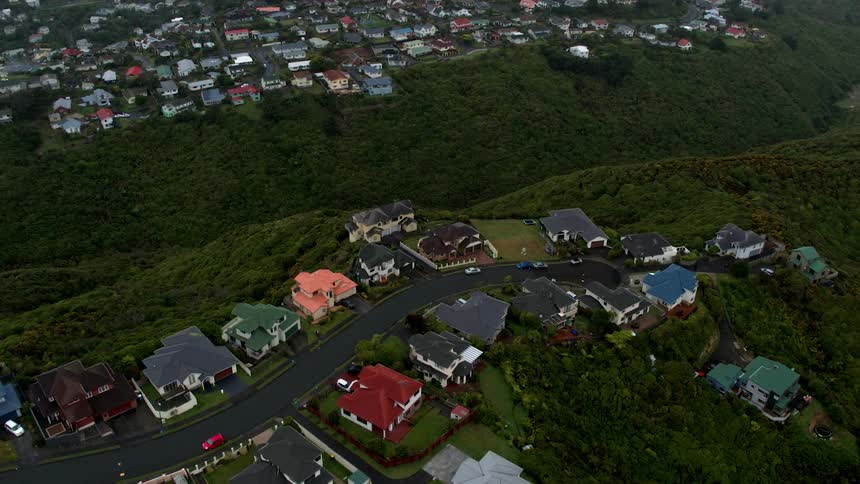 Houses line the winding cliff road