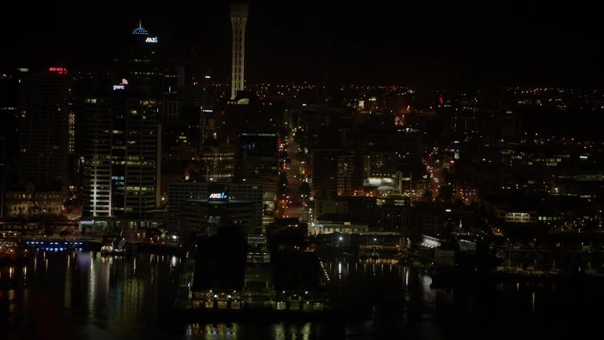 City buildings illuminate the night sky