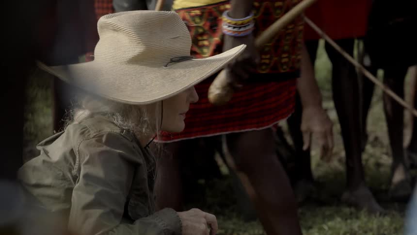 Woman takes pictures of maasai