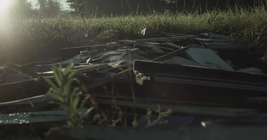 Debris is scattered in the grass