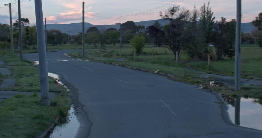 Small puddles cover a small rural road