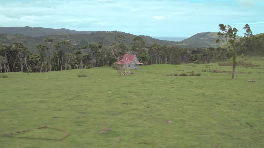 A lone house sits on the hill