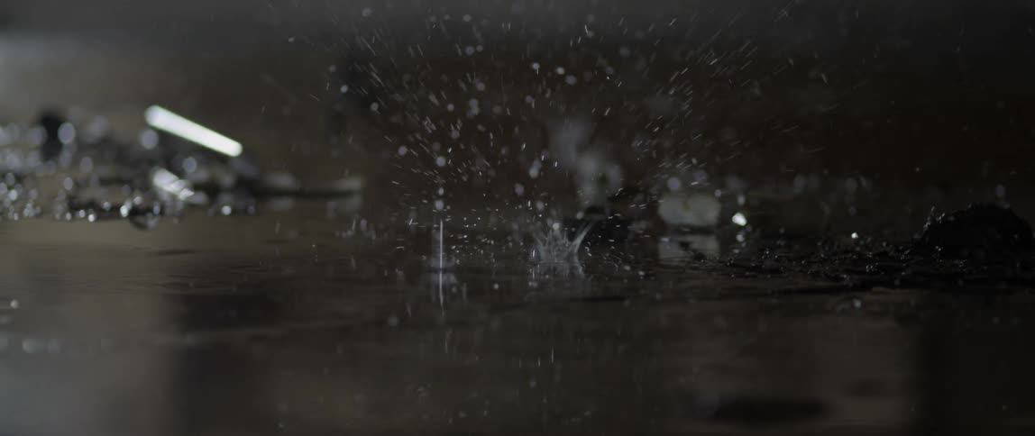 Water drips and pools on the ground