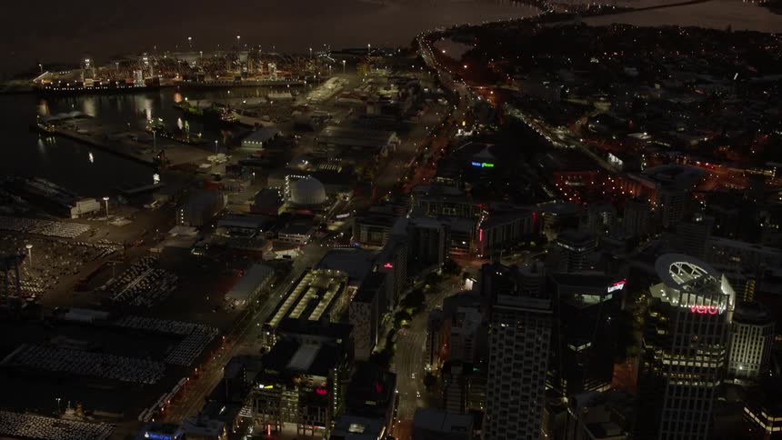 City buildings illuminate the night sky