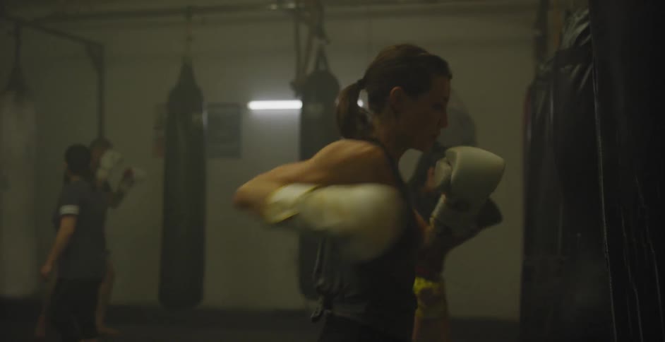 Athletes train sparring with heavy bags