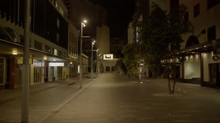 Lamp posts illuminate the city road