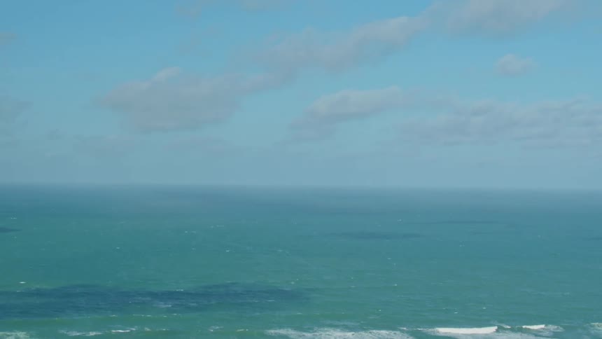 Waves flow onto the beach shore