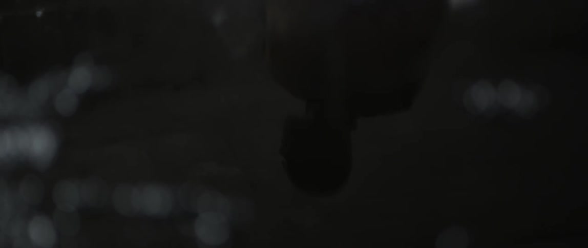 A man walks in a room where water is pooling