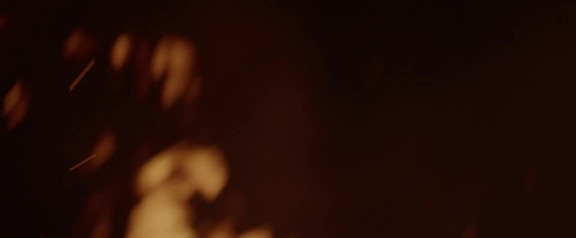 A fire burns wildly at night