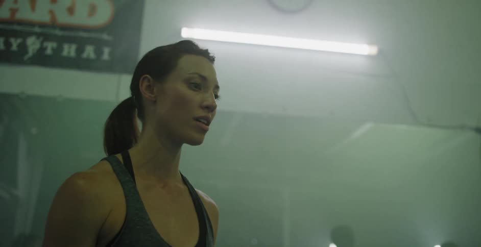 A woman trains in a boxing gym