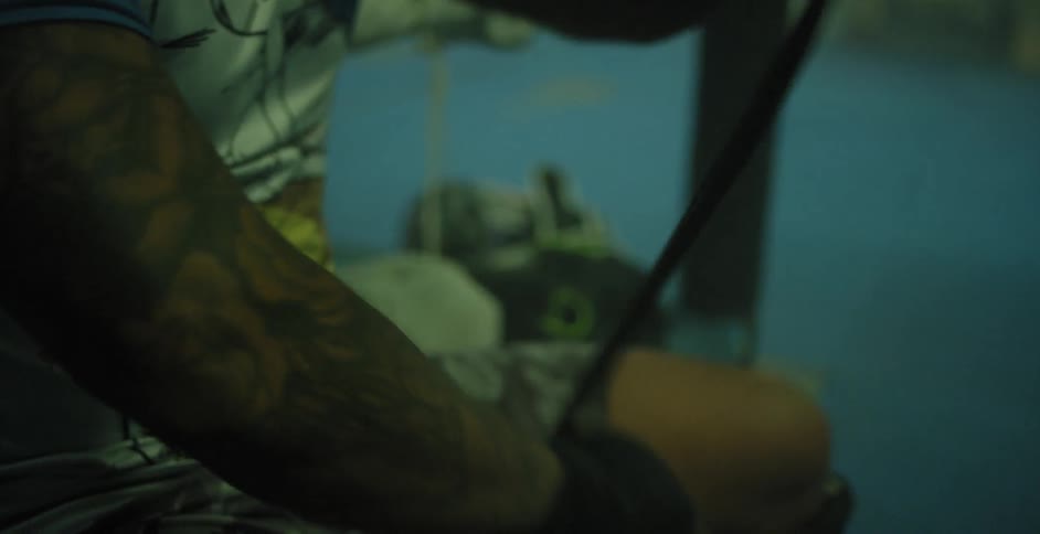 A man wraps his hand with tape